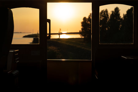View of the sunset from the ship's construction and navigational bridge.