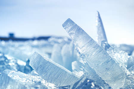Ice floe breaking up against shore with sea ice during freezing winter weather. shelf ice