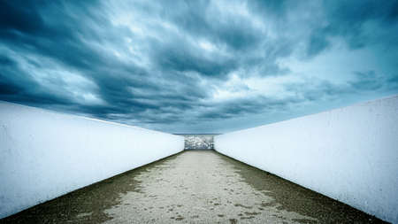 Monumental art allong city beach with sightlines and raw natural weather along the bank of a lake