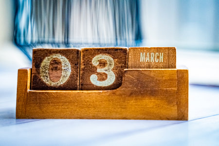 Interior detail of date indication in a wooden accessory with natural light and atmospheric settingの写真素材