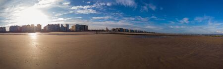 panorama of sand on the beach in a warm autumnal sunlightの写真素材
