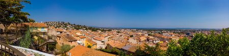 high-angle panoramic view on HyÃ¨res from above la vieux lavoire on a sunny summerdayの写真素材