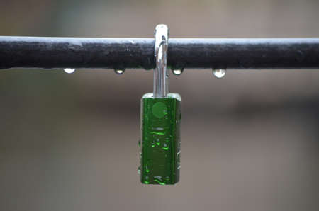 single love padlock in the rain