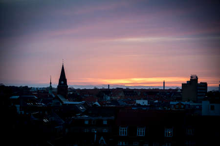 A view over the city at sunsetの写真素材