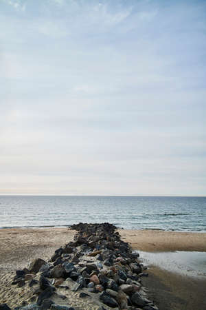 Rock forming a path down to the waterの写真素材