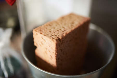 A old sponge in a bucket at a schoolの写真素材