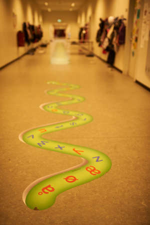 Alphabet game on the floor in a school hallwayの写真素材