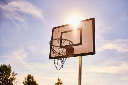 A old basketball net in the sun