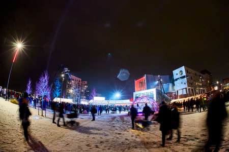 people walking in the streets during light parade in denmarkの写真素材