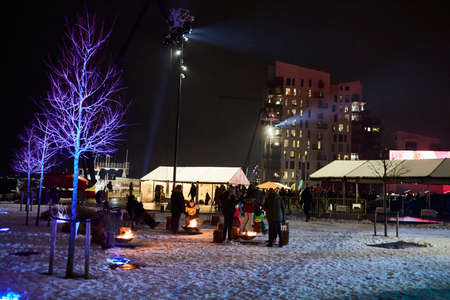 campfire outdoor in snow during a light parade in denmark