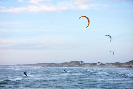 kite surfing on the water in the oceanの写真素材