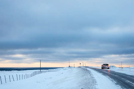 a road in the country side in winterの写真素材