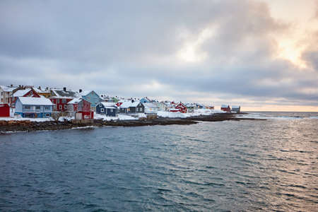 the beautiful beach in winter with snow and clouds