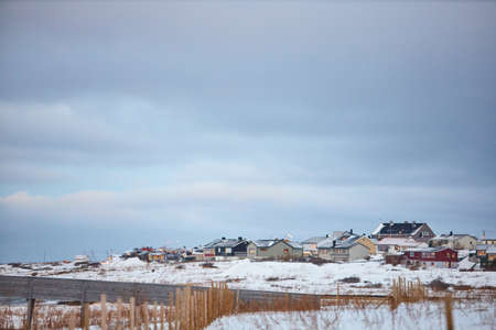 the beautiful beach in winter with snow and cloudsの写真素材