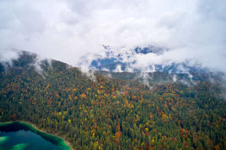 top view of nature landscape of beautiful forest and clear blue lake