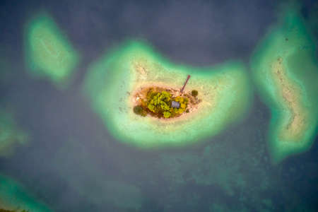top view of nature landscape of beautiful forest and clear blue lakeの写真素材