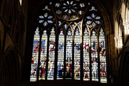 Stained glass window above the main west entrance to St. Albans Cathedral in St. Albansの写真素材