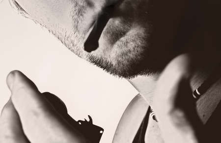 man lighting a cigarette  