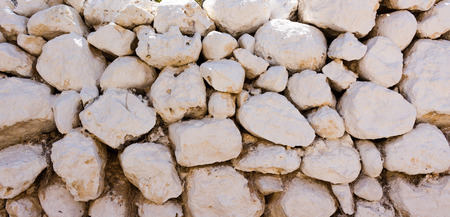 white stones stacked to a wall