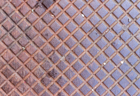 detail of an iron pattern surface on sidewalk