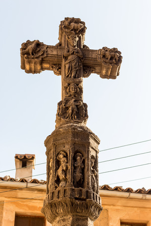 close up of old stone  religious christian cross with a lot of ornamentsの写真素材