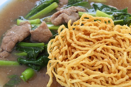 crispy yellow noodle with in a creamy gravy sauceの写真素材