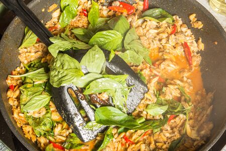 cooking spicy stir fried clams with basil   thai foodの写真素材