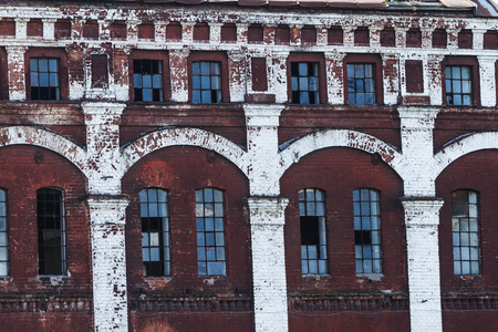 Brick wall with windows of an old building, background
