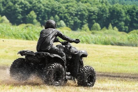 Racing on a dirt atvの写真素材