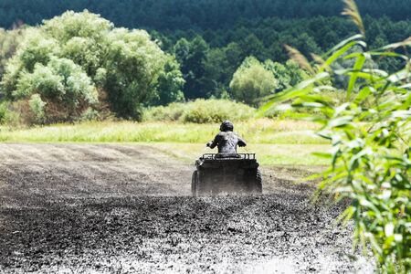 Racing on a dirt atvの写真素材