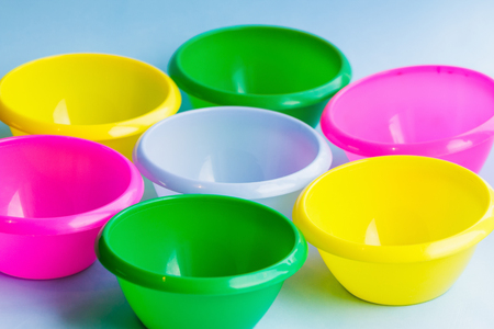 Colorful multicolor dishes on the backgroundの写真素材