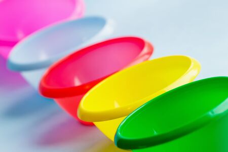 Colorful multicolor dishes on the backgroundの写真素材