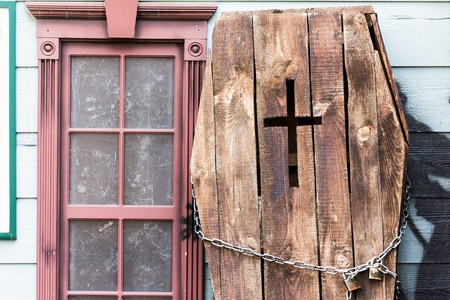 Old dark wooden coffin near the ancient house, vintageの写真素材