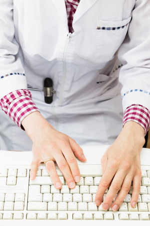 The doctor's hands on the keyboardの写真素材