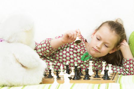 Teen girl playing chessの写真素材