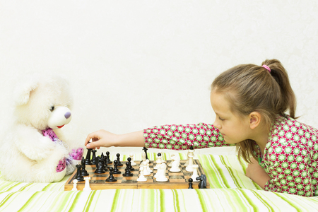 Teen girl playing chessの写真素材