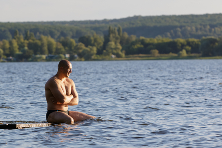 Strong man on the lake.の写真素材