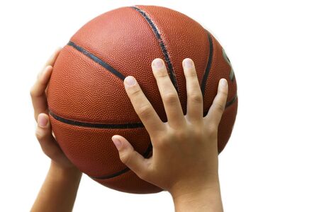 Basketball in the hands of a child.の写真素材