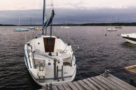 Landscape with a yacht near the pier.