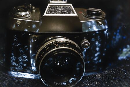Old film retro camera on the background.の写真素材