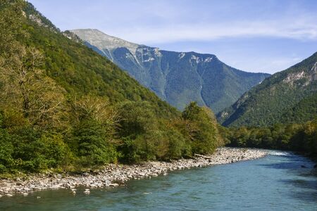 Summer landscape shot of mountains and riverの写真素材