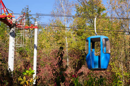 Cable car with colored cabins in autumnの写真素材