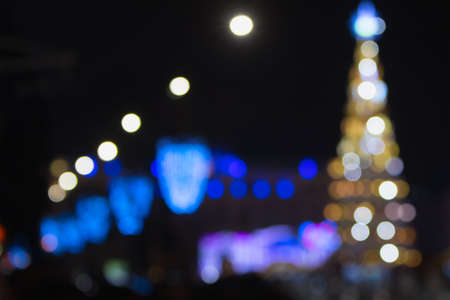 Blurred background on festive Christmas streets, bokeh.