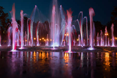 Beautiful colored fountains in the evening.の写真素材