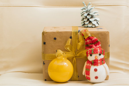 Christmas New Year gift with a Christmas tree cone and toys. Winter holidays. Christmas backgroundの写真素材
