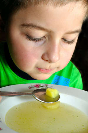 A close-up of a child during a mealの写真素材