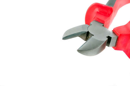 Pliers (side cutters) with red and black plastic tongs on thighsの写真素材