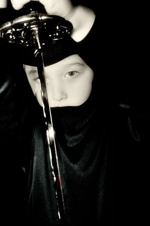 Ninja with a sword on the black background