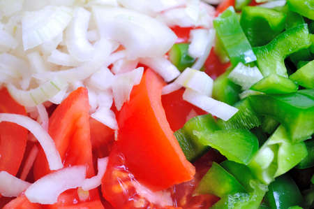 Chopped onion, tomatoes and peppersの写真素材