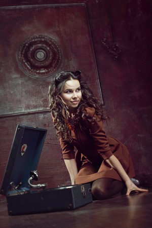 Yoing girl is listening music with the gramophoneの写真素材